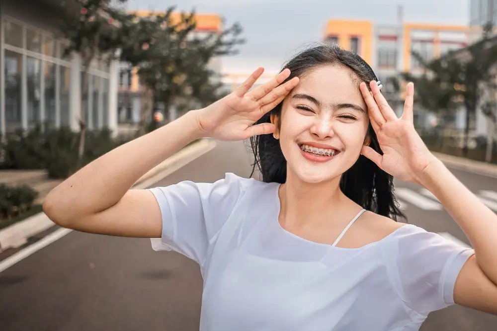 happy woman wearing braces